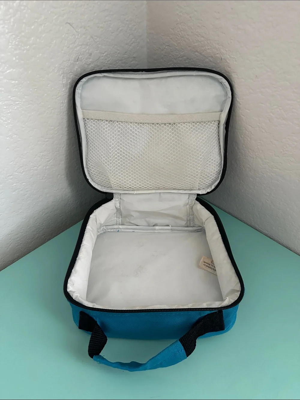 Walmart blue insulated lunch box with a minimalist white ’LUNCH’ graphic-used